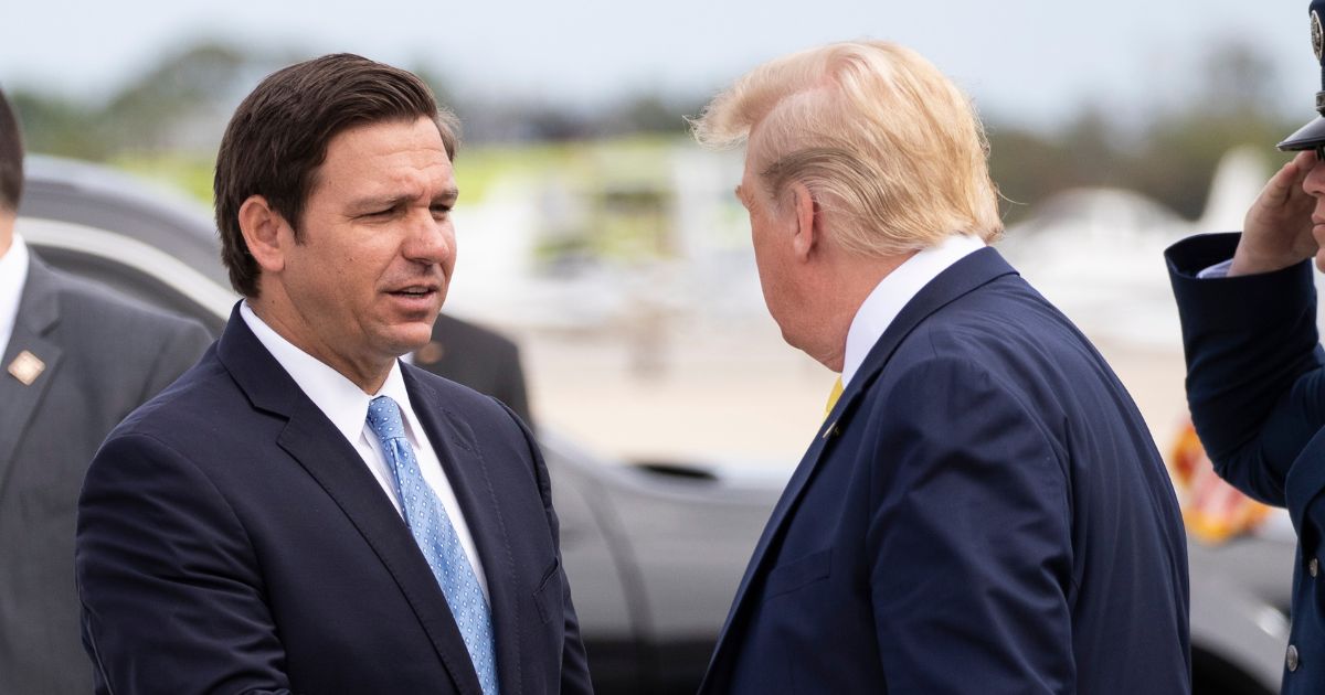 Ron DeSantis greeting Donald Trump at the Orlando airport in 2020