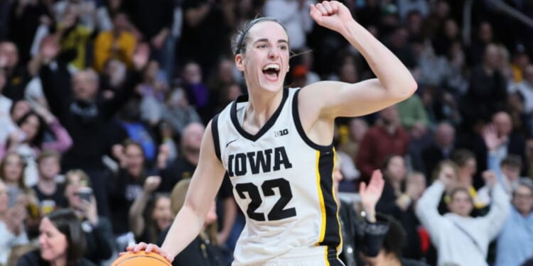 Caitlin Clark, of the Iowa Hawkeyes, celebrates after beating the LSU Tigers 94-87 in the Elite 8 round of the NCAA Women's Basketball Tournament at MVP Arena Monday in Albany, New York.