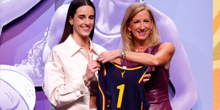 Caitlin Clark poses with WNBA Commissioner Cathy Engelbert after being selected first overall pick by the Indiana Fever during the 2024 WNBA Draft in New York City on Monday.