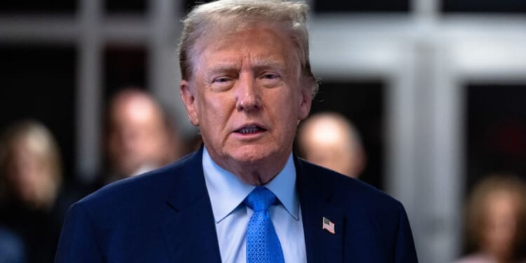 Former President Donald Trump speaks to members of the media during his hush money trial at Manhattan criminal court in New York City on Friday.