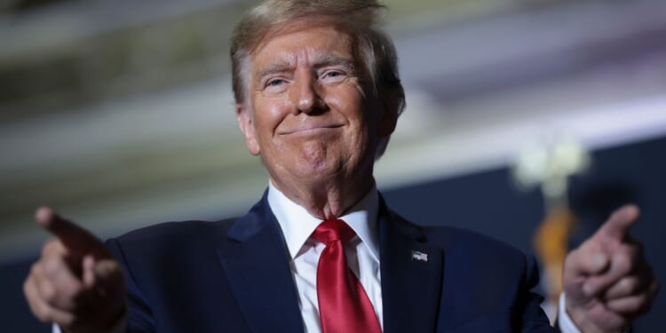 Former President Donald Trump gestures to supporters after speaking at a Get Out The Vote rally in North Charleston, South Carolina, on Feb. 14.