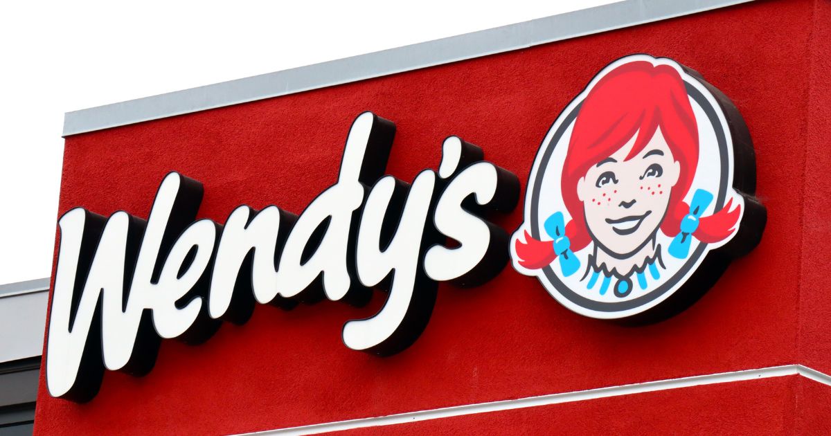 A stock photo shows a sign at a Wendy's restaurant in Los Angeles on June 16.