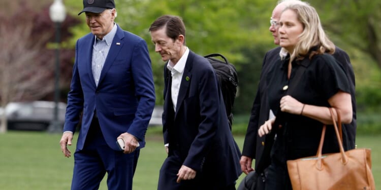 President Joe Biden walks to the White House with senior members of his staff after landing on the South Lawn in Marine One on April 17. Biden spent the night in the Pittsburgh area, delivering remarks at the United Steelworkers headquarters.