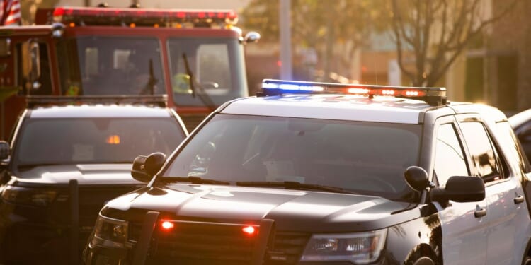 a stock photo of police, fire and paramedic units responding to the scene of an emergency