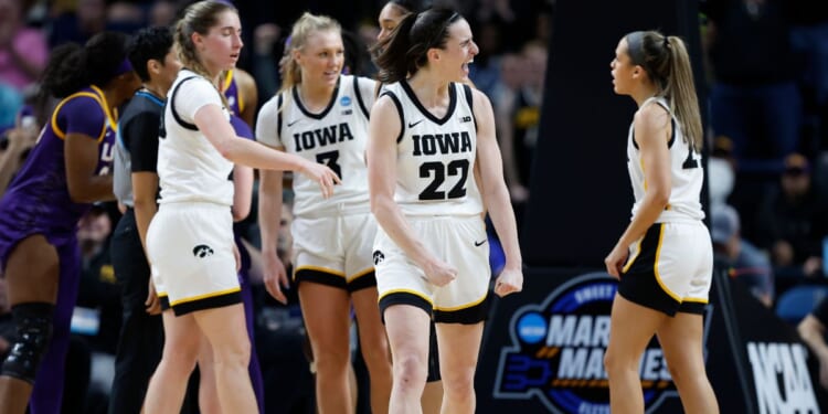 Iowa Hawkeyes Caitlin Clark, 22, celebrates during the second half against the LSU Tigers in the Elite 8 round of the NCAA Women's Basketball Tournament in Albany, New York, on Monday.