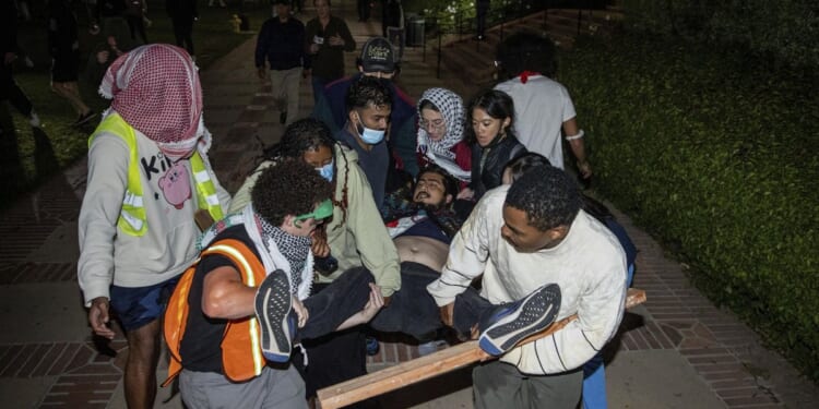 Protest at UCLA becomes violent; police in riot gear separate groups