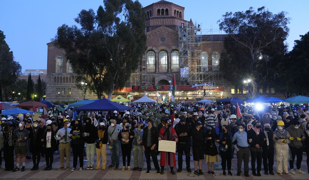 Pro-Palestinian protesters remain on UCLA campus despite police ordering them to leave