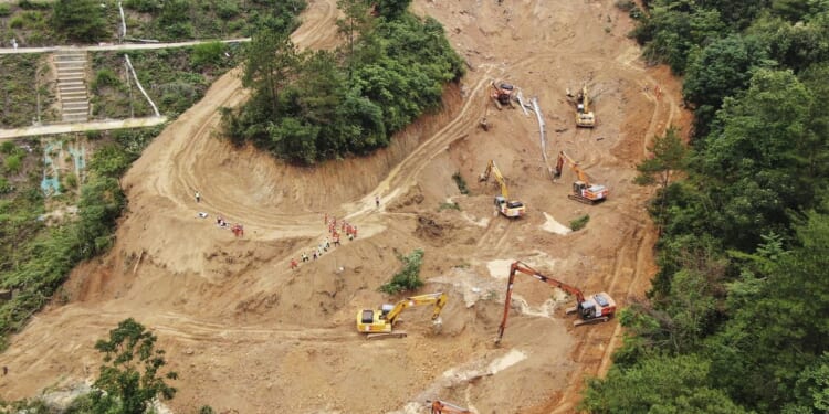 Death toll climbs to at least 48 as a search continues in southern China highway collapse