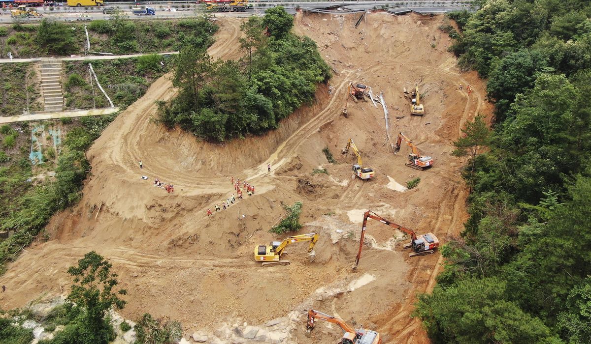 Death toll climbs to at least 48 as a search continues in southern China highway collapse