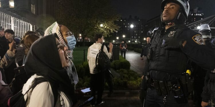 Joe Biden keeps quiet as Gaza protesters and police clash on college campuses