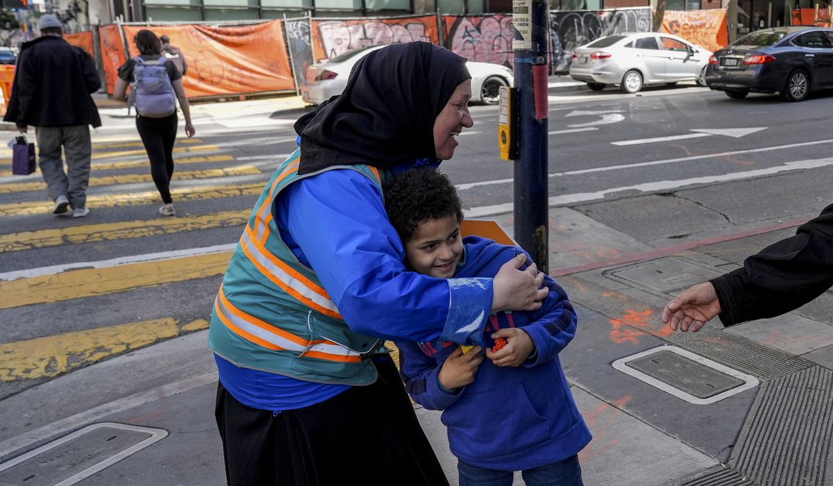 Helpers escort kids through San Francisco's Tenderloin neighborhood