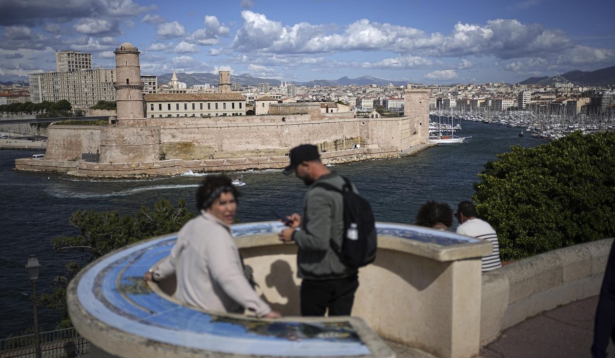 The Olympic torch being welcomed in French port city of Marseille with fanfare and high security