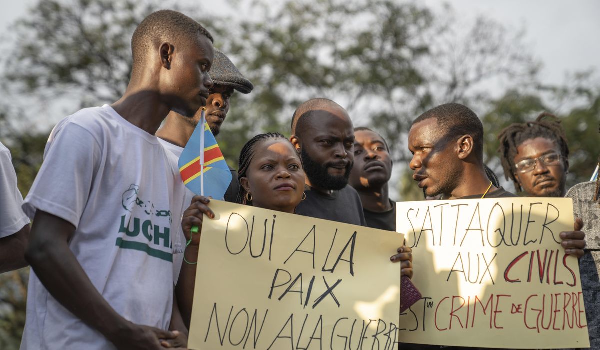 Families of victims of attacks on displaced people in Congo mourn their dead