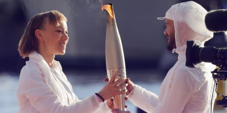 Olympic torch begins journey across France after Marseille's festive welcome