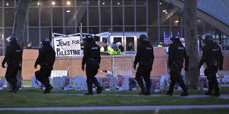 Police pull apart pro-Palestinian tent encampment at MIT