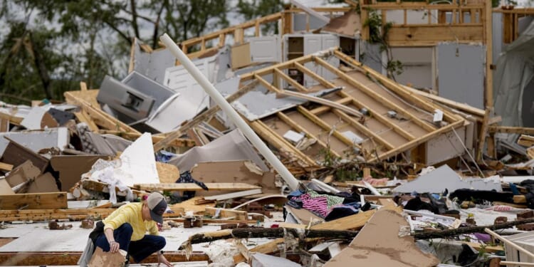 Storm-battered South under threat. A boy swept into a drain fights for his life