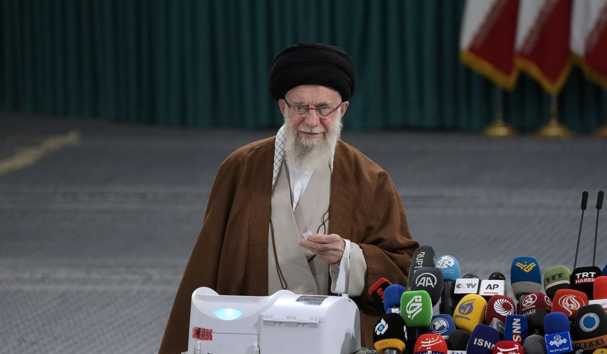 Iranians voting in parliamentary runoff election after hard-liners dominate initial balloting