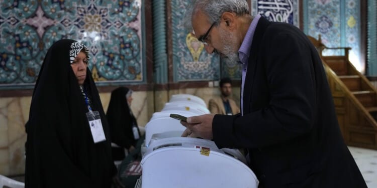 A parliamentary election runoff puts hard-liners firmly in charge of Iran's parliament