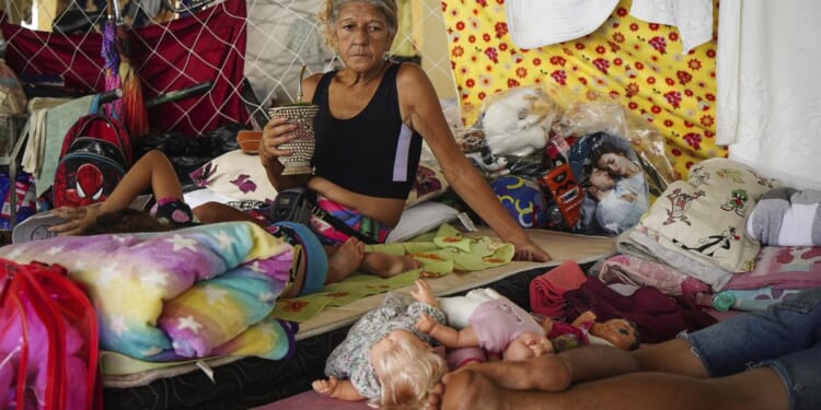 More heavy rain expected in Brazil's south, where many who remain are poor