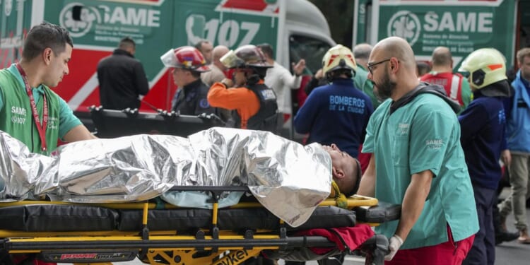 A train in central Buenos Aires strikes a boxcar on the track, injuring dozens