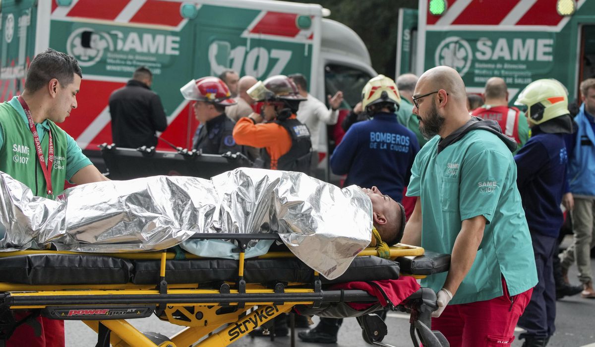 A train in central Buenos Aires strikes a boxcar on the track, injuring dozens