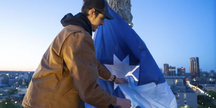 Minnesota unfurls new state flag atop the capitol