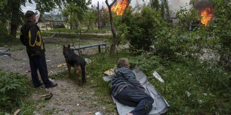 Russia presses renewed border assault and thousands of civilians flee northeast Ukraine