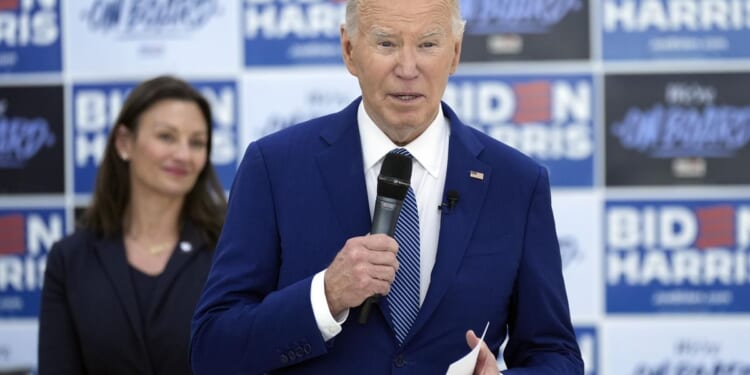 Bishops upbraid Biden for crossing himself at abortion rally