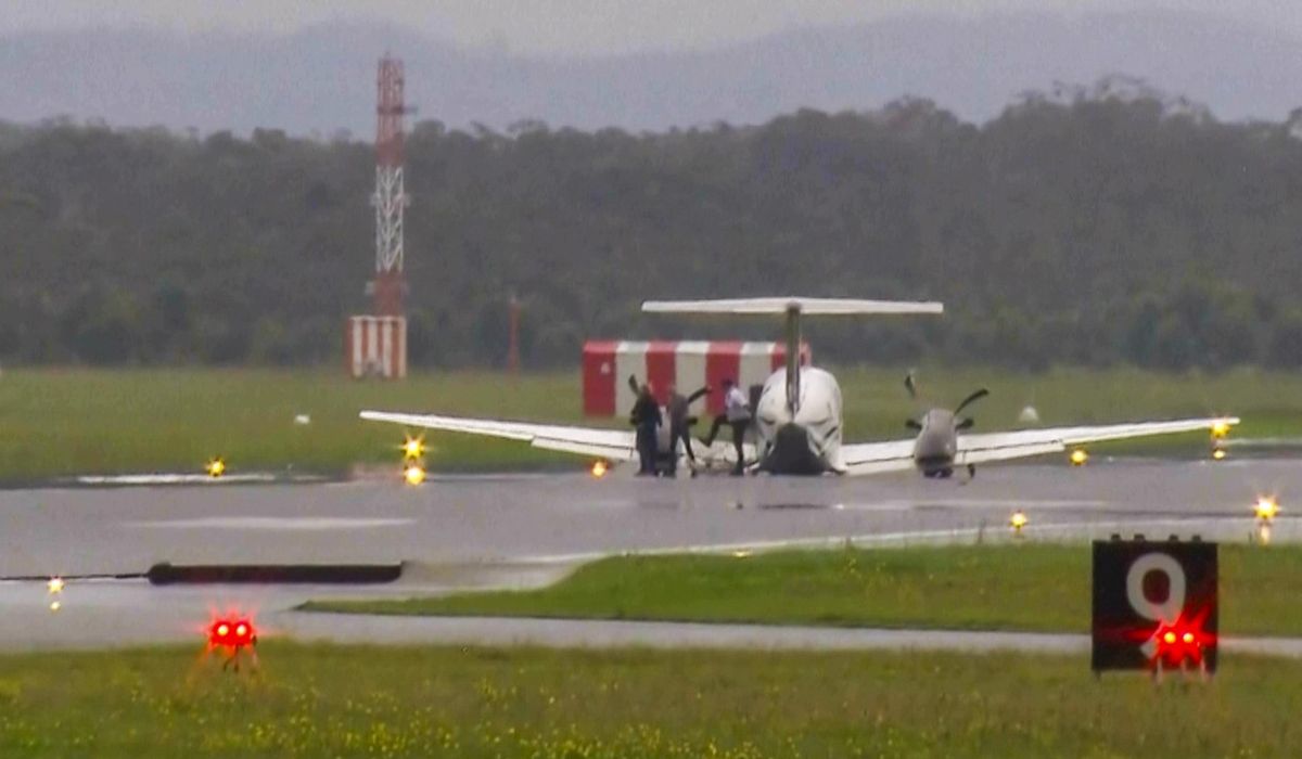 A plane with three aboard lands without landing gear at an Australian airport after burning off fuel