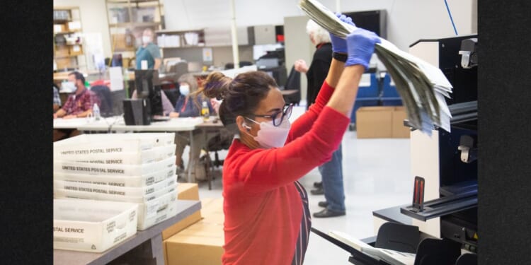 Votes are counted by staff at the Maricopa County Elections Department office on Nov. 5, 2020. in Phoenix, Arizona.