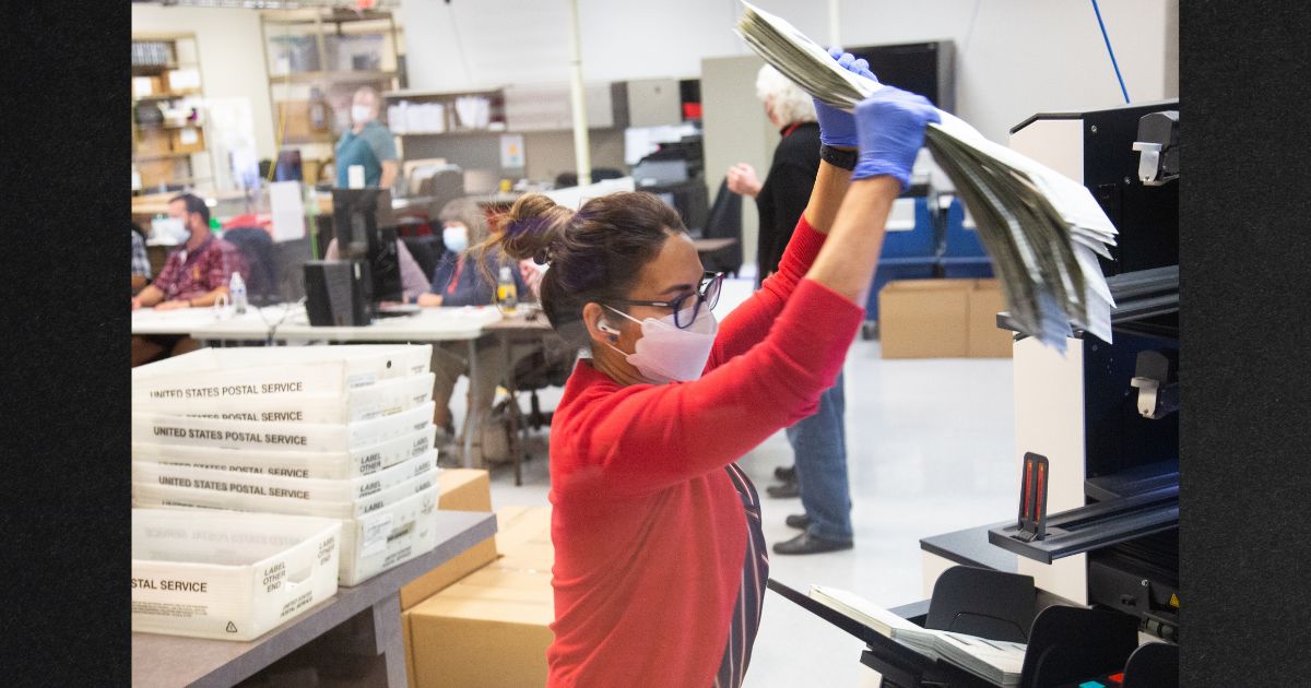 Votes are counted by staff at the Maricopa County Elections Department office on Nov. 5, 2020. in Phoenix, Arizona.