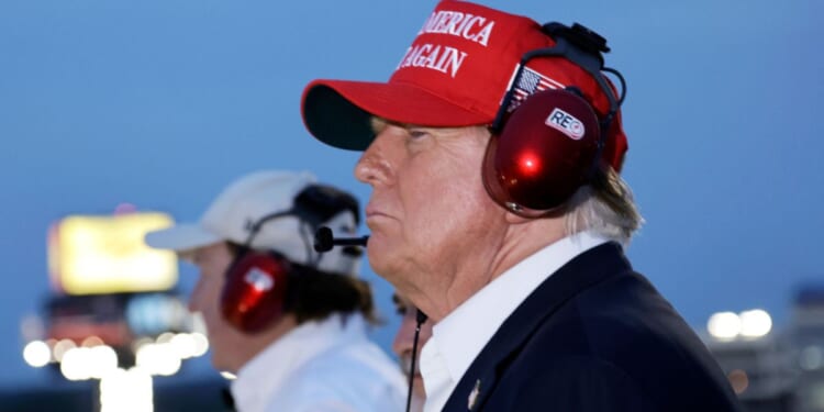 Donald Trump watches the NASCAR Coca-Cola 600 from the top of the press box