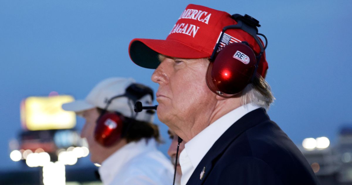 Donald Trump watches the NASCAR Coca-Cola 600 from the top of the press box