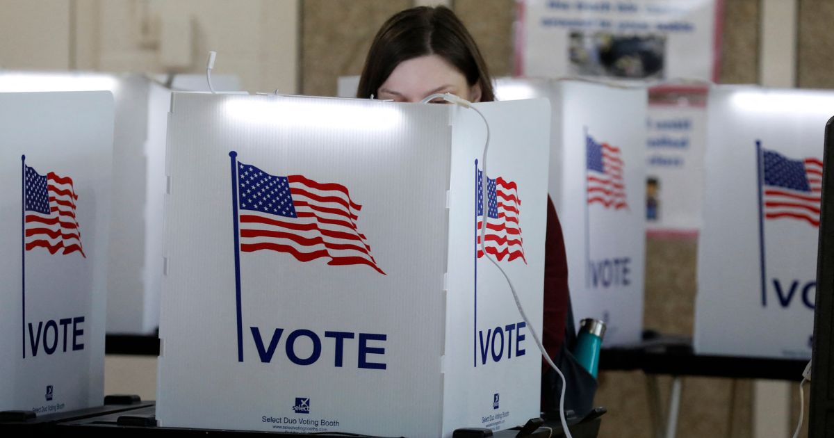 People vote in the Michigan primary election at Chrysler Elementary School in Detroit, Michigan, on March 10, 2020.