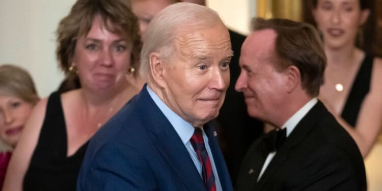 Joe greeting visitors at a state dinner at the White House