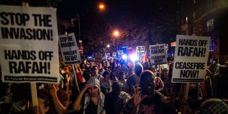 Pro-Palestinian demonstrators march back to George Washington University Tuesday in Washington, D.C. Pro-Palestinian encampments have sprung up at college campuses around the country with some demonstrators calling for schools to divest from Israeli interests amid the ongoing war in Gaza.