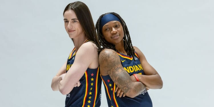 Caitlin Clark, left, and Erica Wheeler pose during the Indiana Fever's media-day activities Wednesday at Gainbridge Fieldhouse in Indianapolis.