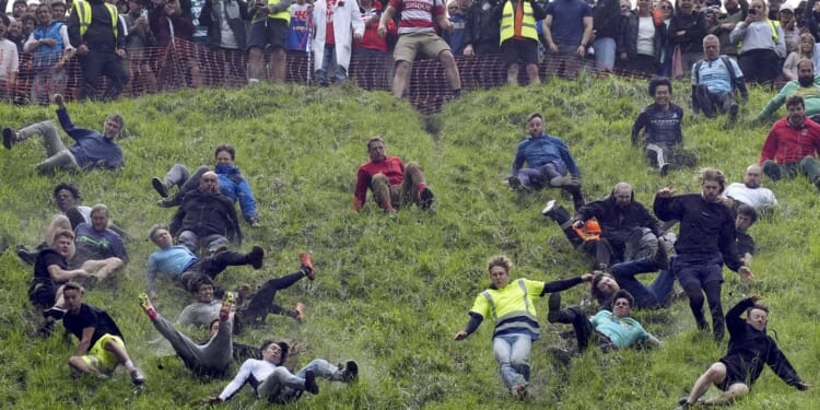 Chasing cheese wheels or lugging sacks of wool, U.K. competitors embrace quirky extreme races