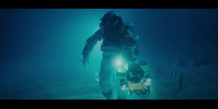 A man walking on the bottom of the ocean in a diver suit in the remaster to James Cameron's classic film "The Abyss."