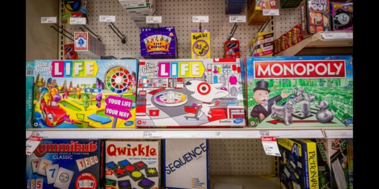 Hasbro board games sitting on a store shelf in a Target located in Austin, Texas.