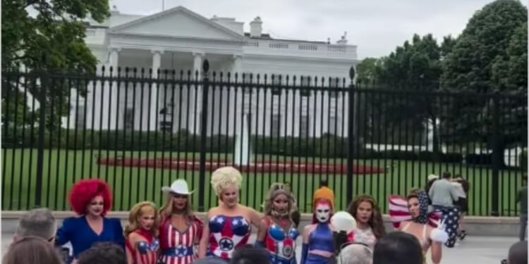 A group of eight drag queens from "Ru Paul's Drag Race All Stars" pose outside the White House in Washington, D.C., on Monday.