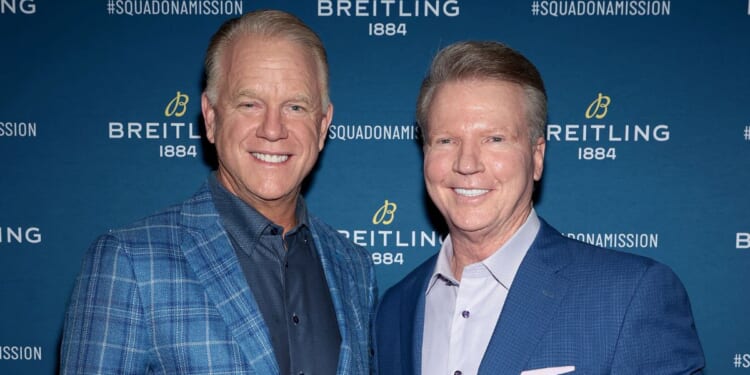 Boomer Esiason and Phil Simms, seen in a file photo from November 2021, will no longer co-host "NFL Today" on CBS, it was announced Monday.