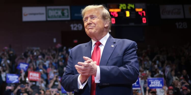 Republican presidential candidate and former President Donald Trump arrives on stage for a rally at Winthrop University in Rock Hill, South Carolina, on Feb. 23.