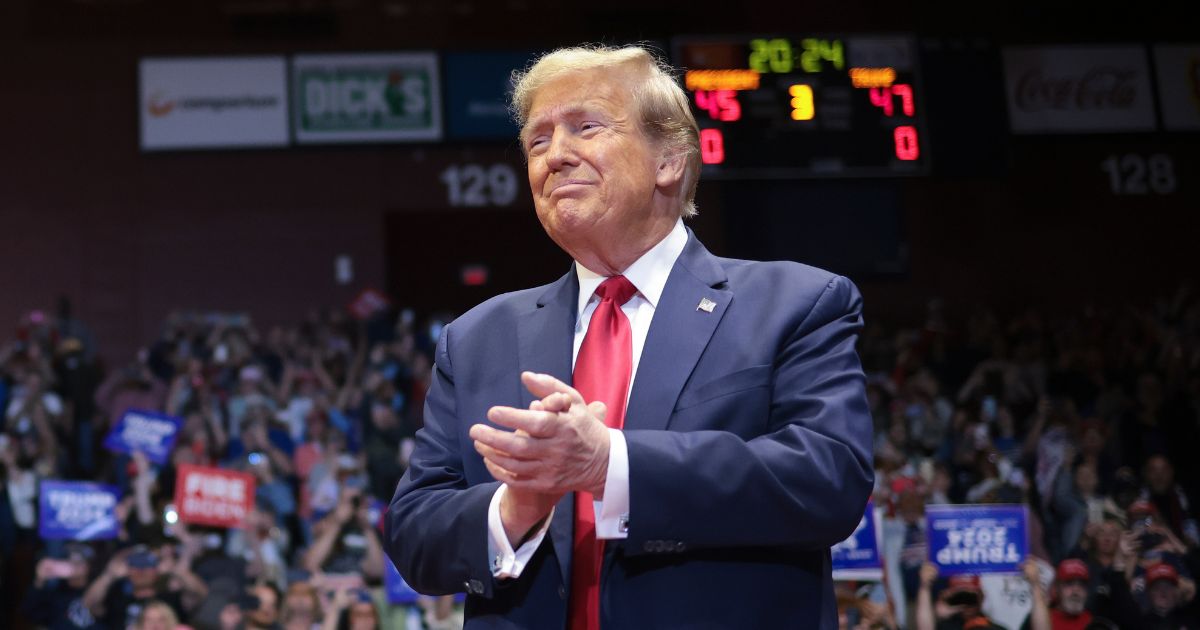 Republican presidential candidate and former President Donald Trump arrives on stage for a rally at Winthrop University in Rock Hill, South Carolina, on Feb. 23.