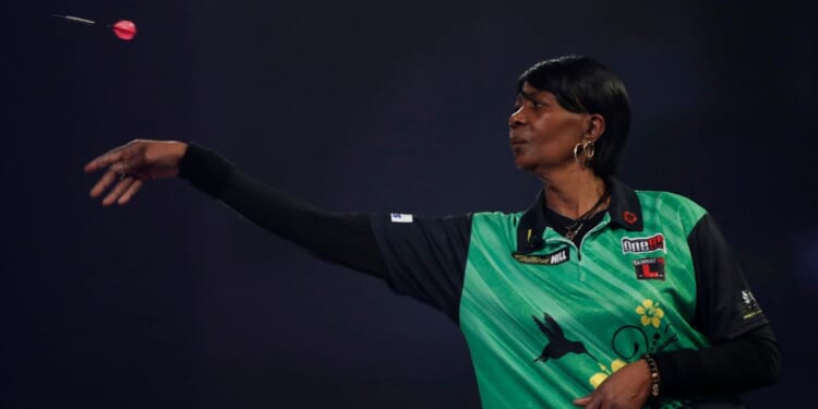 Deta Hedman competes in the PDC William Hill World Darts Championship at Alexandra Palace in London on Dec. 19, 2020.