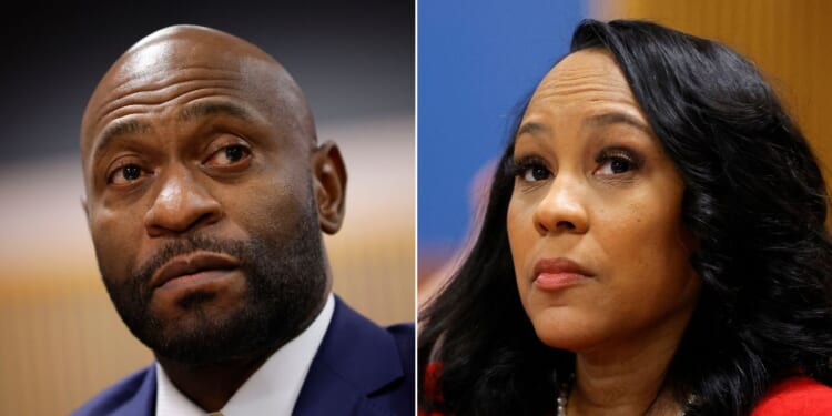 Special prosecutor Nathan Wade, left, and Fulton County District Attorney Fani Willis, right, are seen in court during a hearing at the Fulton County Courthouse in Atlanta on March 1.