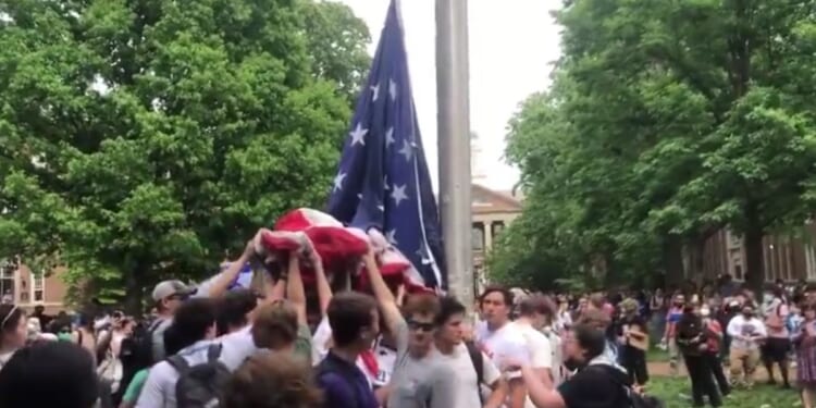 Fraternity men from University of North Carolina - Chapel Hill went viral for defending the American flag from protesters who sought to tear it down and replace it with a Palestinian one.