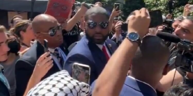 U.S. Rep. Byron Donalds of Florida turns to face a heckler on Wednesday on the campus of George Washington University.