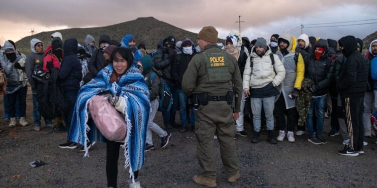 Illegal immigrants are processed by border patrol agents at an improvised camp near the U.S.-Mexico border in Jacumba, California, on Feb. 2.