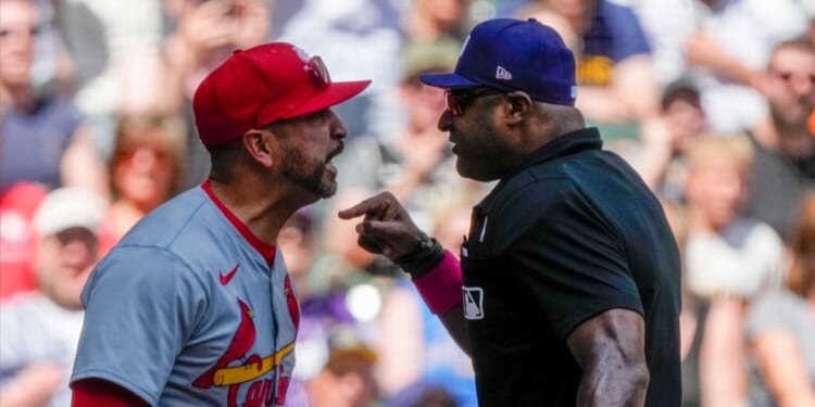 St. Louis Cardinals manager Oliver Marmol argues with home plate umpire Alan Porter during the third inning of the Cardinals game against the Milwaukee Brewers on Sunday.